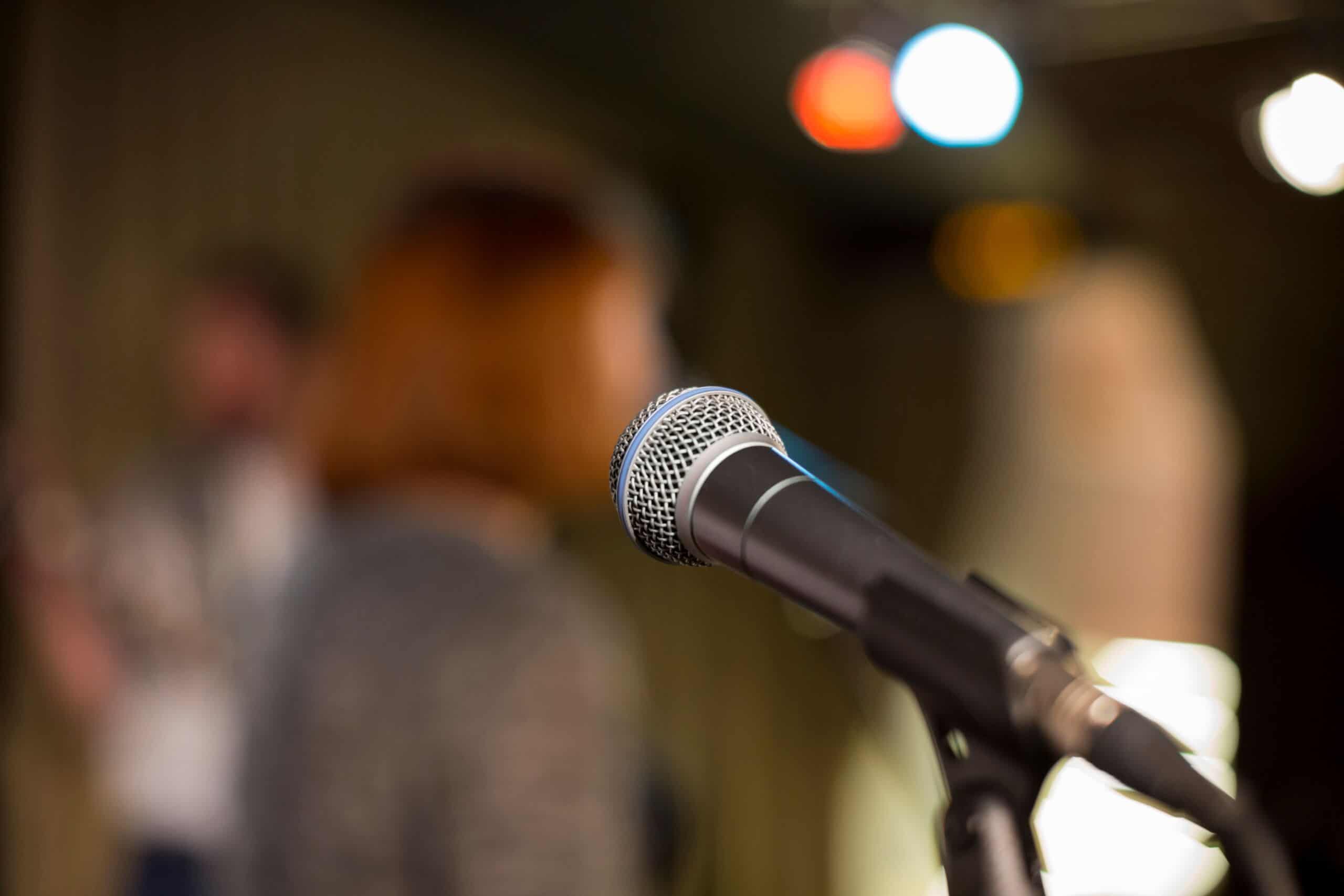 Microphone on a blurred background, the people in the club